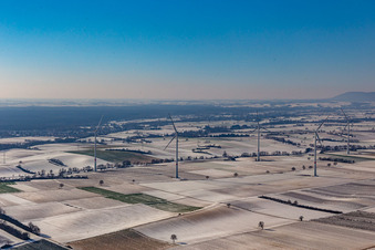 Wintry snowy wind turbine windmills on a field in Freckenfeld in the state Rhineland-Palatinate, Germany