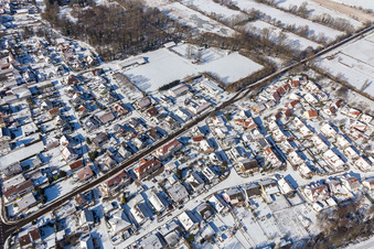 Winter aerial view in the snow Steinweilerer Straße in Winden in the state Rhineland-Palatinate, Germany