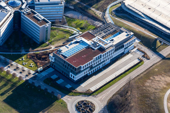 Star-shaped office buildings of the SAP Deutschland SE & Co. KG at the forest edged in Walldorf in the state Baden-Wuerttemberg from above