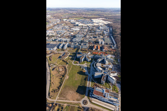 Star-shaped office buildings of the SAP Deutschland SE & Co. KG at the forest edged in Walldorf in the state Baden-Wuerttemberg from the plane