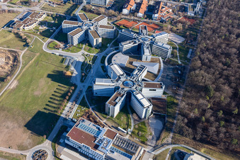 Bird's eye view of Star-shaped office buildings of the SAP Deutschland SE & Co. KG at the forest edged in Walldorf in the state Baden-Wuerttemberg