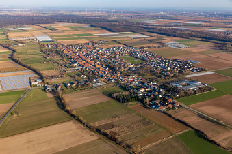 Village view on the edge of agricultural fields and land in Gommersheim in the state Rhineland-Palatinate, Germany