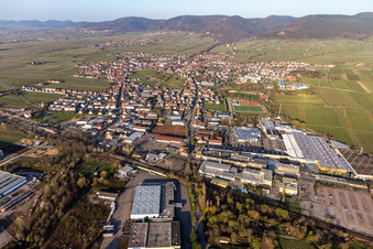 Aerial photograpy of Location view of the streets and houses of residential areas in the rhine valley landscape surrounded by mountains in Edenkoben in the state Rhineland-Palatinate, Germany
