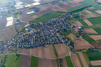Aerial view of Agricultural land and field boundaries surround the settlement area of the village in Schuttern in the state Baden-Wuerttemberg, Germany