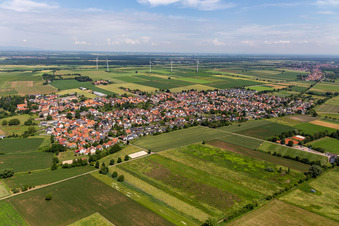 Village view on the edge of agricultural fields and land in Minfeld in the state Rhineland-Palatinate, Germany