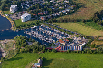 Pleasure boat marina of CLUB NAUTIC e.V. with docks and moorings on the shore area of the Foerde with Restaurant "Leuchtturm" in Schausende in Gluecksburg in the state Schleswig-Holstein, Germany