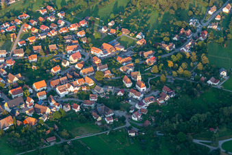 Aerial view of Village view on the edge of agricultural fields and land in Wittendorf at Black-Forest in the state Baden-Wuerttemberg, Germany