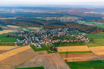 Aerial view of Agricultural land and field boundaries surround the settlement area of the village in Marschalkenzimmern in the state Baden-Wuerttemberg, Germany