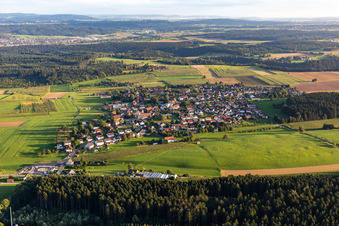 Agricultural land and field boundaries surround the settlement area of the village in Hausen ob Rottweil in the state Baden-Wuerttemberg, Germany