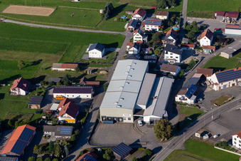 Oblique view of Building and production halls on the premises of Beurer GmbH in Uttenweiler in the state Baden-Wuerttemberg, Germany