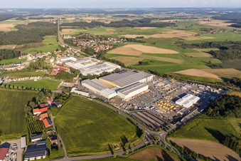 Oblique view of Building and production halls on the premises of Liebherr-Mischtechnik GmbH in Bad Schussenried in the state Baden-Wuerttemberg, Germany