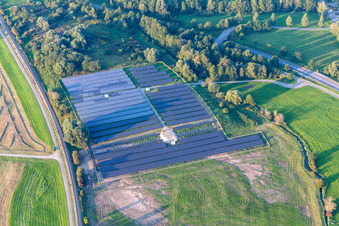 Rows of panels of a solar power plant and photovoltaic system on a field in Ertingen in the state Baden-Wuerttemberg, Germany