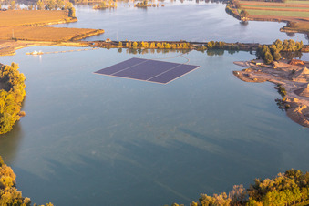 Floating photovoltaic island on gravel pond in Leimersheim in the state Rhineland-Palatinate, Germany