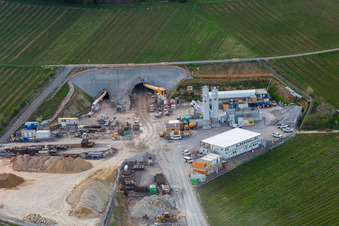 Construction site of the eastern tunnel portal for the Astrid Tunnel for the underpass and bypass of Bad Bergzabern between B38 (Weinstraße) and B427 (Kurtalstraße) in Dörrenbach in the state Rhineland-Palatinate, Germany from the plane