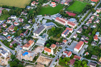 Aerial photograpy of Church of the Annunciation and PhysioKlinik im Aitrachtal GmbH in the district Weichshofen in Mengkofen in the state Bavaria, Germany