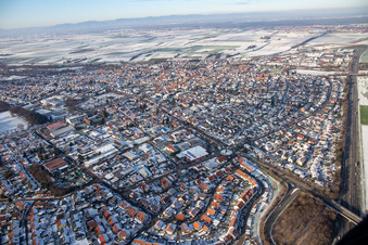 Aerial view of Kuhhardter Straße in winter with snow in Rülzheim in the state Rhineland-Palatinate, Germany