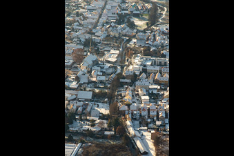 Aerial view of Braun Foundation and St. Mauritius Church in winter with snow in Rülzheim in the state Rhineland-Palatinate, Germany