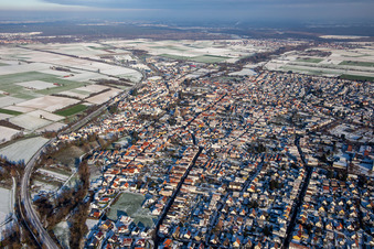 From the west in winter when there is snow in Rülzheim in the state Rhineland-Palatinate, Germany from above