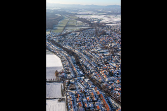 Ketteler Straße in winter with snow in Herxheim bei Landau in the state Rhineland-Palatinate, Germany