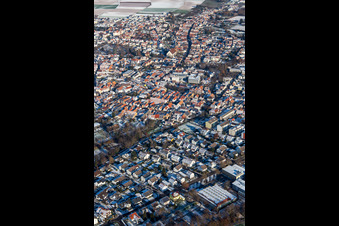 Aerial view of Upper Main Street in winter with snow in Herxheim bei Landau in the state Rhineland-Palatinate, Germany