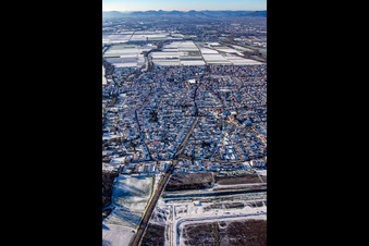 Germersheimer Straße from the east in winter with snow in Offenbach an der Queich in the state Rhineland-Palatinate, Germany