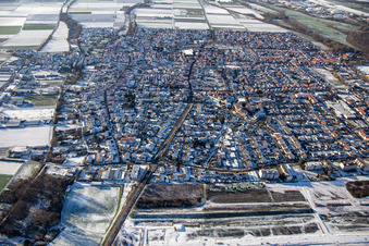 Aerial view of Germersheimer Straße from the east in winter with snow in Offenbach an der Queich in the state Rhineland-Palatinate, Germany