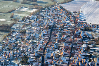 Back alley and main street in winter with snow in Rohrbach in the state Rhineland-Palatinate, Germany