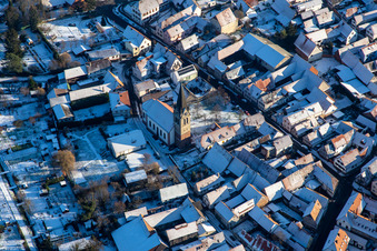 Church of St. Martin in winter with snow in Steinweiler in the state Rhineland-Palatinate, Germany