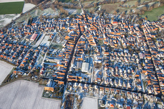 Aerial photograpy of Main street in winter with snow in Steinweiler in the state Rhineland-Palatinate, Germany