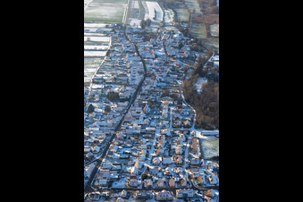 Main road B427 from the east in winter with snow in Winden in the state Rhineland-Palatinate, Germany