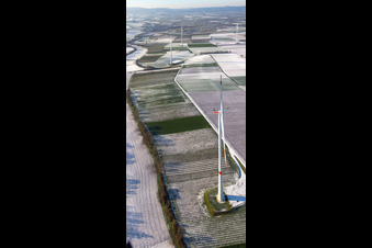 Aerial view of Wind farm in winter with snow in Freckenfeld in the state Rhineland-Palatinate, Germany