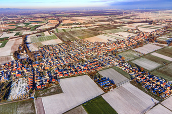 Aerial view of View of the town from the southwest in winter with snow in Freckenfeld in the state Rhineland-Palatinate, Germany