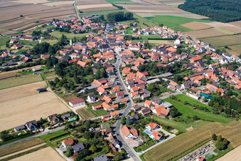 Aerial view of Village - view on the edge of agricultural fields and farmland in Salmbach in Grand Est, France