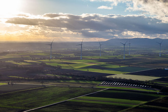 Open-space photovoltaic solar power system of the ANUMAR Solarpark Winden on a field in front of the Freckenfeld wind farm in Winden in the state Rhineland-Palatinate, Germany