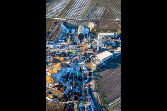 Oblique view of Construction site of the tunnel portal east for the Astrid Tunnel for the underpass and bypass of Bad Bergzabern between B38 (Weinstraße) and B427 (Kurtalstraße) in winter with snow in Dörrenbach in the state Rhineland-Palatinate, Germany