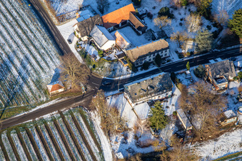 Aerial view of Landhotel Windhof in winter with snow in Schweighofen in the state Rhineland-Palatinate, Germany