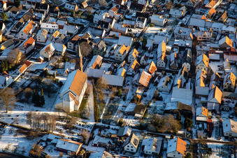 Parish Church of St. Ulrich in winter with snow in Kapsweyer in the state Rhineland-Palatinate, Germany