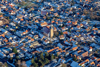 Catholic Church of St. Leodegar in winter with snow in Steinfeld in the state Rhineland-Palatinate, Germany