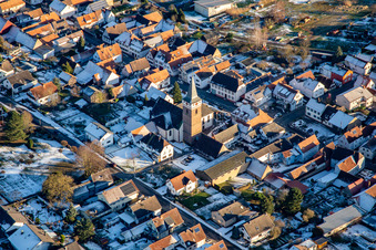 Parish Church of St. Leo in winter with snow in the district Schaidt in Wörth am Rhein in the state Rhineland-Palatinate, Germany