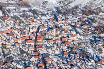 Laurentius Church from the south in winter in the snow in Göcklingen in the state Rhineland-Palatinate, Germany