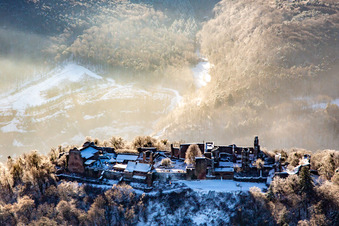 Oblique view of Runie Madenburg in winter with snow in Eschbach in the state Rhineland-Palatinate, Germany