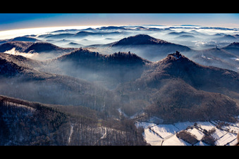 Trifels Castle, Anebos and Scharfenberg castle ruins from the northeast in winter with snow in Annweiler am Trifels in the state Rhineland-Palatinate, Germany