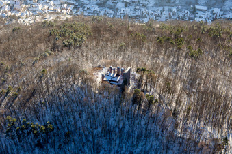 Ramburg castle ruins in winter with snow in Ramberg in the state Rhineland-Palatinate, Germany out of the air