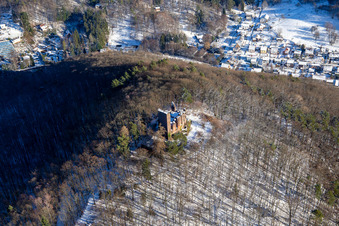 Ramburg castle ruins in winter with snow in Ramberg in the state Rhineland-Palatinate, Germany seen from above
