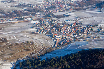 Aerial photograpy of Keschdebusch vineyard from the west in winter with snow in Birkweiler in the state Rhineland-Palatinate, Germany