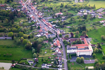 Aerial view of Rue Saint-Michel, Clos du chateau and École élémentaire publique in Neufgrange in the state Moselle, France
