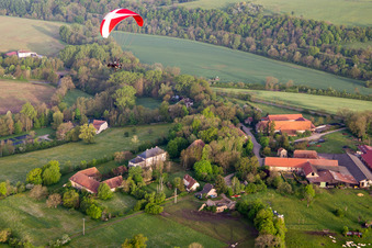 Paramotor in the morning over Chapelle Sainte-Barbe in Kalhausen in the state Moselle, France