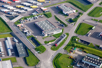 Aerial photograpy of Industrial estate with KIMMEL LOGISTICS, KIMMEL LAVAGE, Dietrich Véhicules and Sarre Union Pl Services - MAN at the Sarre-Union toll station - A4 - Route No. 42 in Thal-Drulingen in the state Bas-Rhin, France