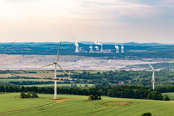 Aerial photograpy of Czech wind farm Wetzwalde (Větrný park Václavice) in front of the Polish brown coal open-cast mine Kopalnia Węgla Brunatnego Turów in Hrádek nad Nisou in the state Liberec, Czech Republic