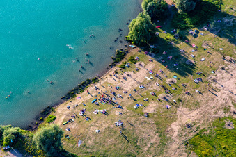 Many bathers on the lawn at Epplesee in the district Silberstreifen in Rheinstetten in the state Baden-Wuerttemberg, Germany
